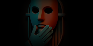 A stylized, half-red, half-blue mask with large circular eye holes is depicted on a dark background. A detached hand is positioned as if touching the chin.