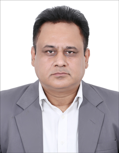  Portrait of a person wearing a gray suit and white shirt, facing forward against a plain white background.